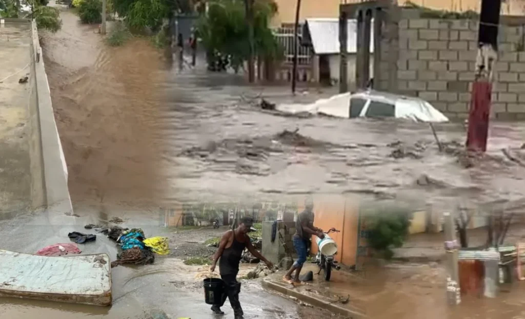 Vehículo es arrastrado por cañada desbordada en Baní tras lluvias de la tormenta tropical Melissa Vehículo